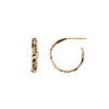 A set of small 14k gold hoop earrings with a textured design.
