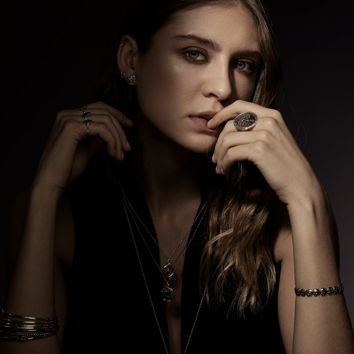 A close up of a model wearing our Moon & Stars Studs.