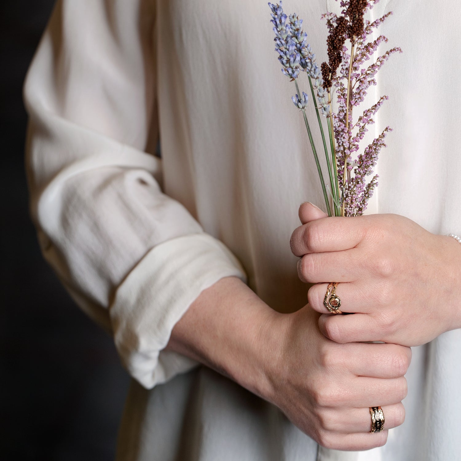 A model wearing our Narrow Grey Rustic Diamond 14K Gold Faceted Stone Ring.