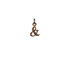 A bronze Ampersand charm.