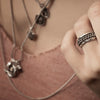 A model wearing our silver triple band chain ring