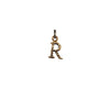 A bronze "R" charm.
