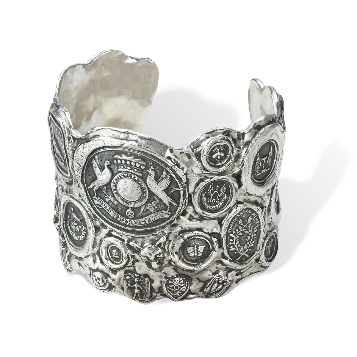 A close up of our Wide Multi Talisman Cuff, a selection of talismans fused together to create a meaningful cuff.