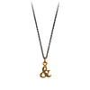 A bronze Ampersand charm on a blackened sterling silver chain.