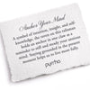 A hand-torn, letterpress printed card describing the meaning for Pyrrha's Anchor Your Mind Signature Talisman Necklace