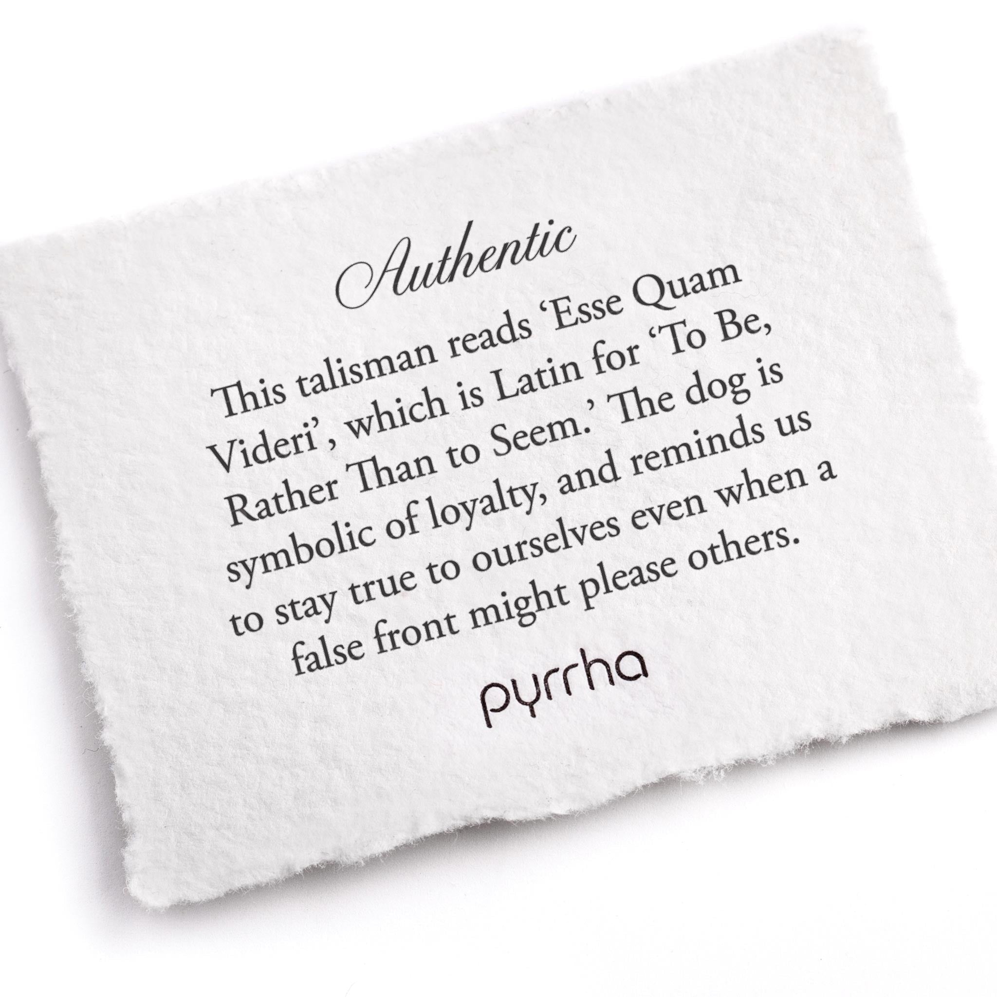 A hand-torn, letterpress printed card describing the meaning for Pyrrha's Authentic Talisman