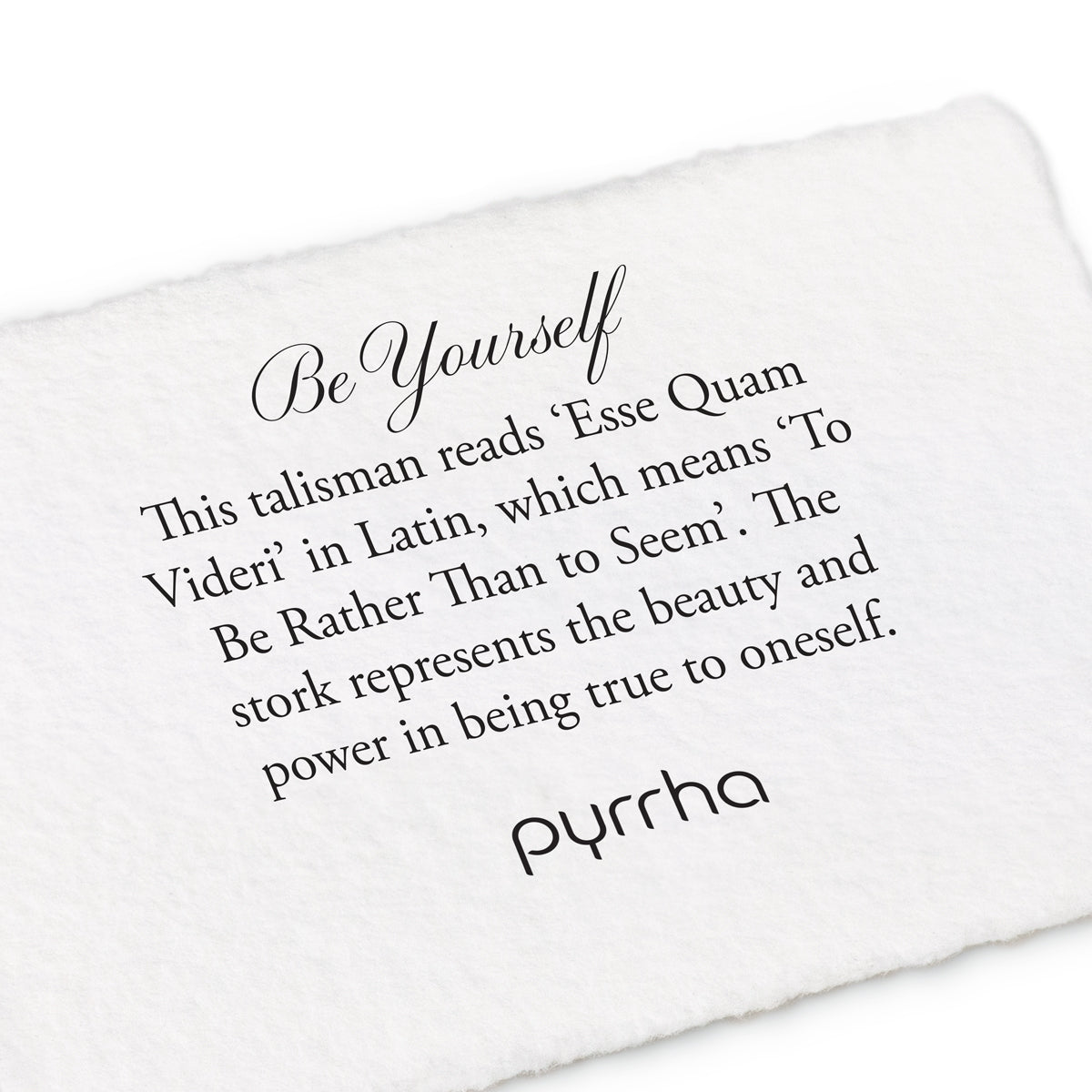 A hand-torn, letterpress printed card describing the meaning for Pyrrha's Be Yourself Talisman Necklace