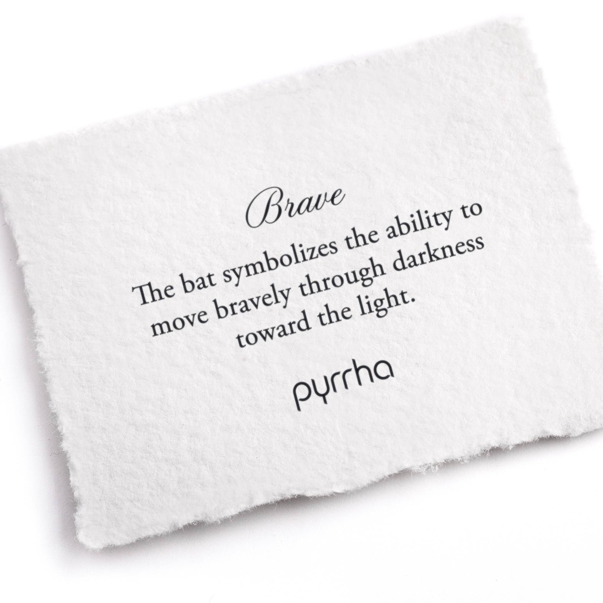 A hand-torn, letterpress printed card describing the meaning for Pyrrha's Brave Appreciation Talisman