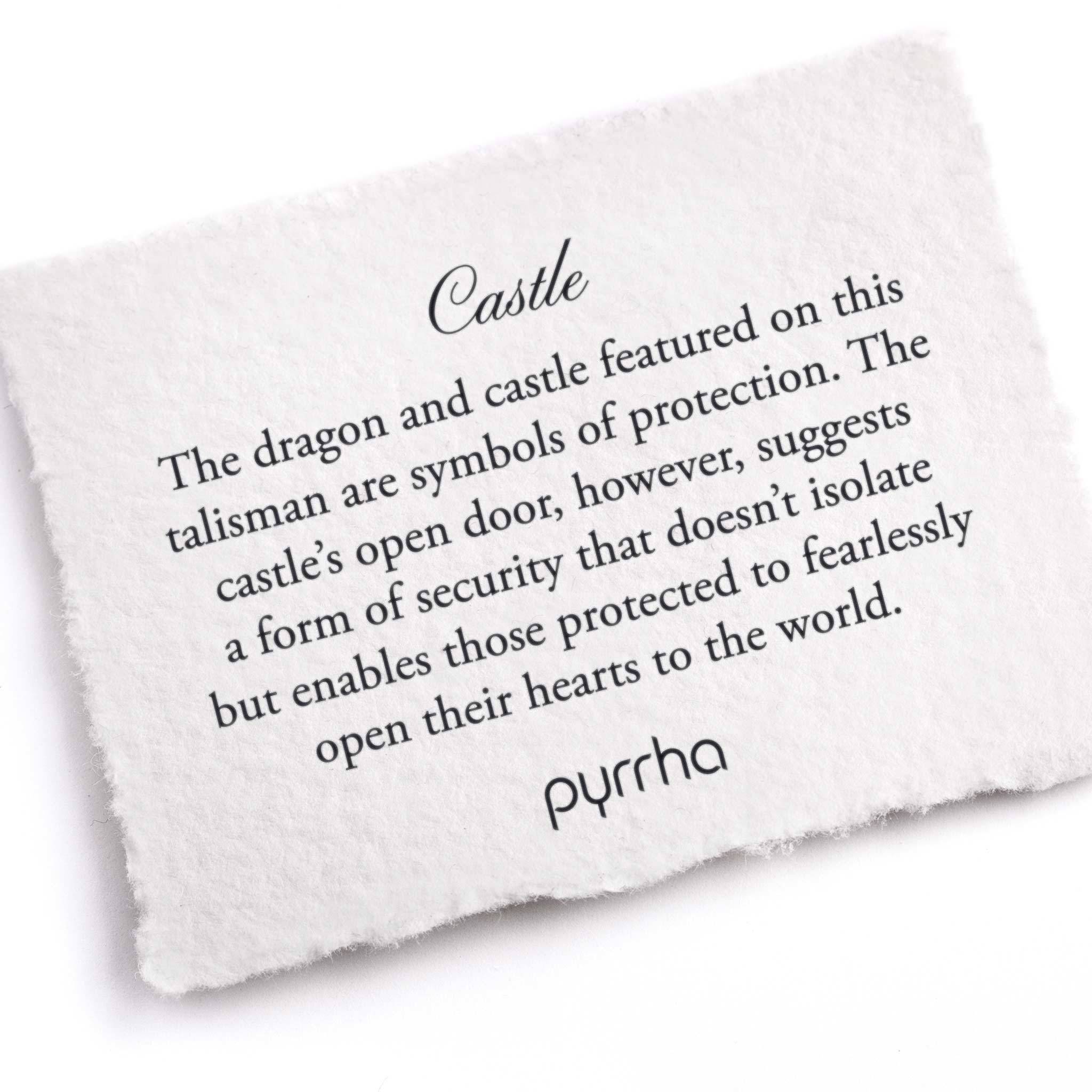 A hand-torn, letterpress printed card describing the meaning for Pyrrha's Castle Talisman