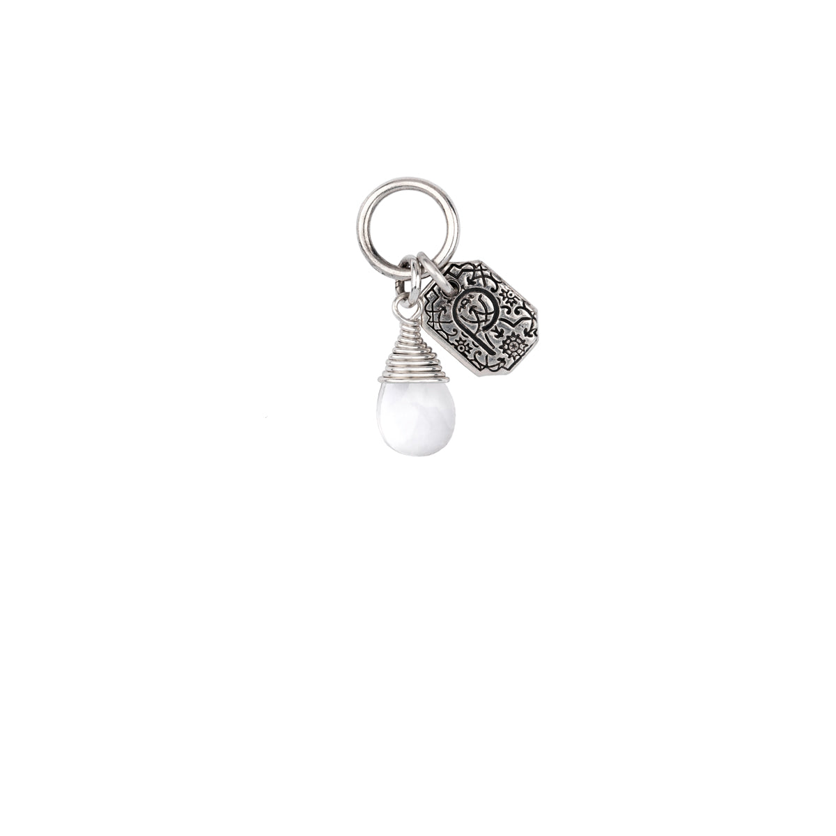 A sterling silver signature attraction charm capped with a clear quartz stone.