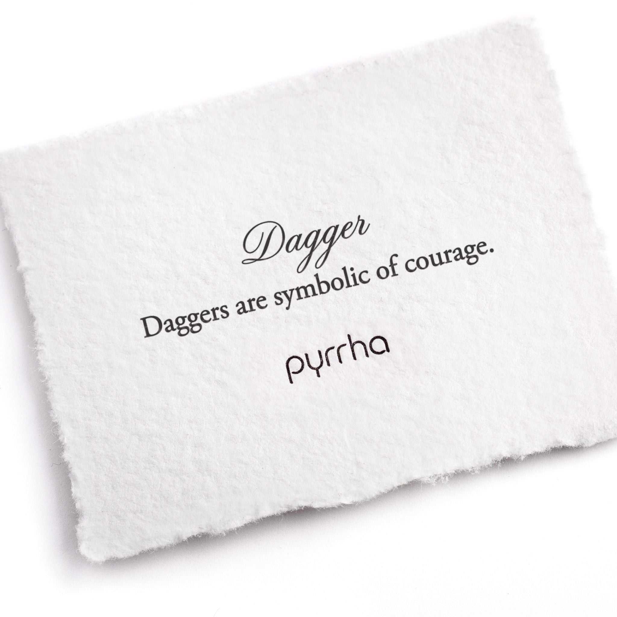 A handtorn cotton card describing the meaning for our Dagger 14K Gold Talisman Stud.