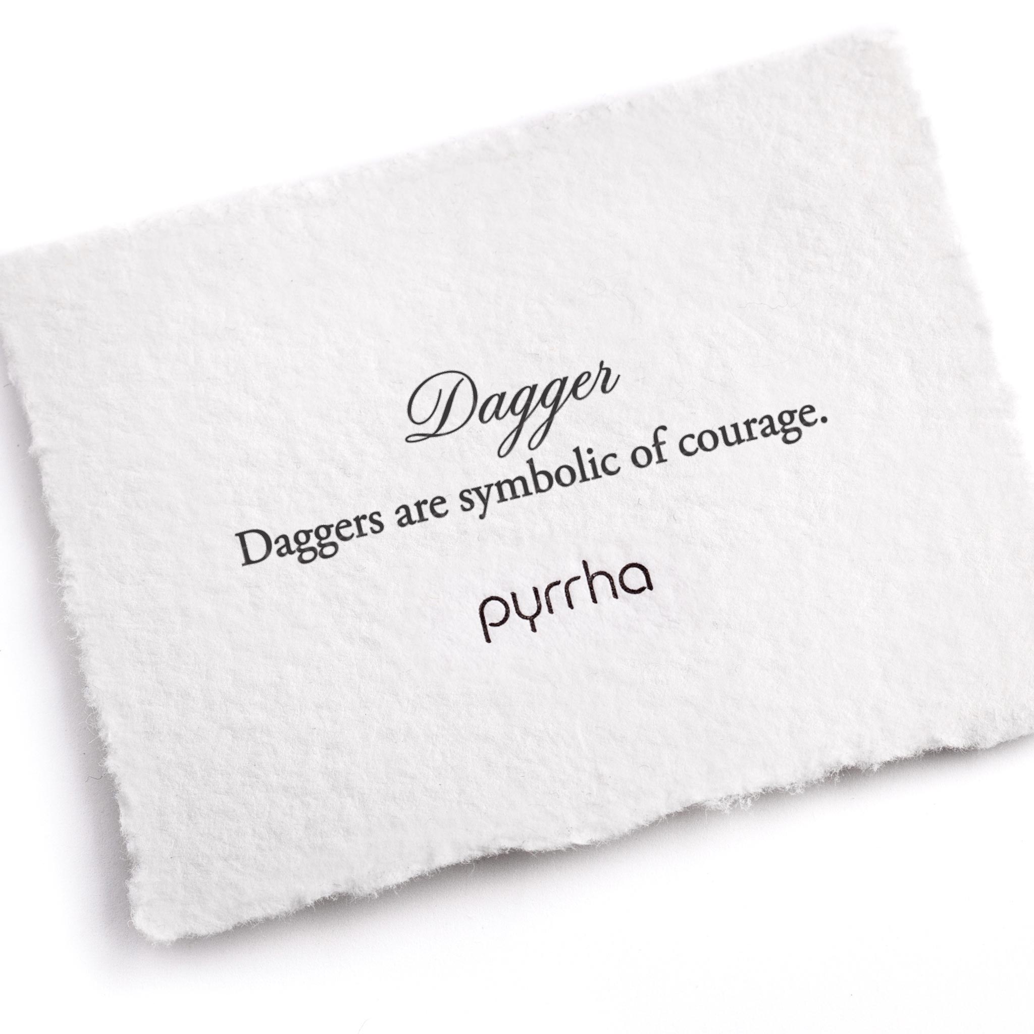 A handtorn cotton card describing the meaning for our Dagger 14K Gold Symbol Charm Bracelet.