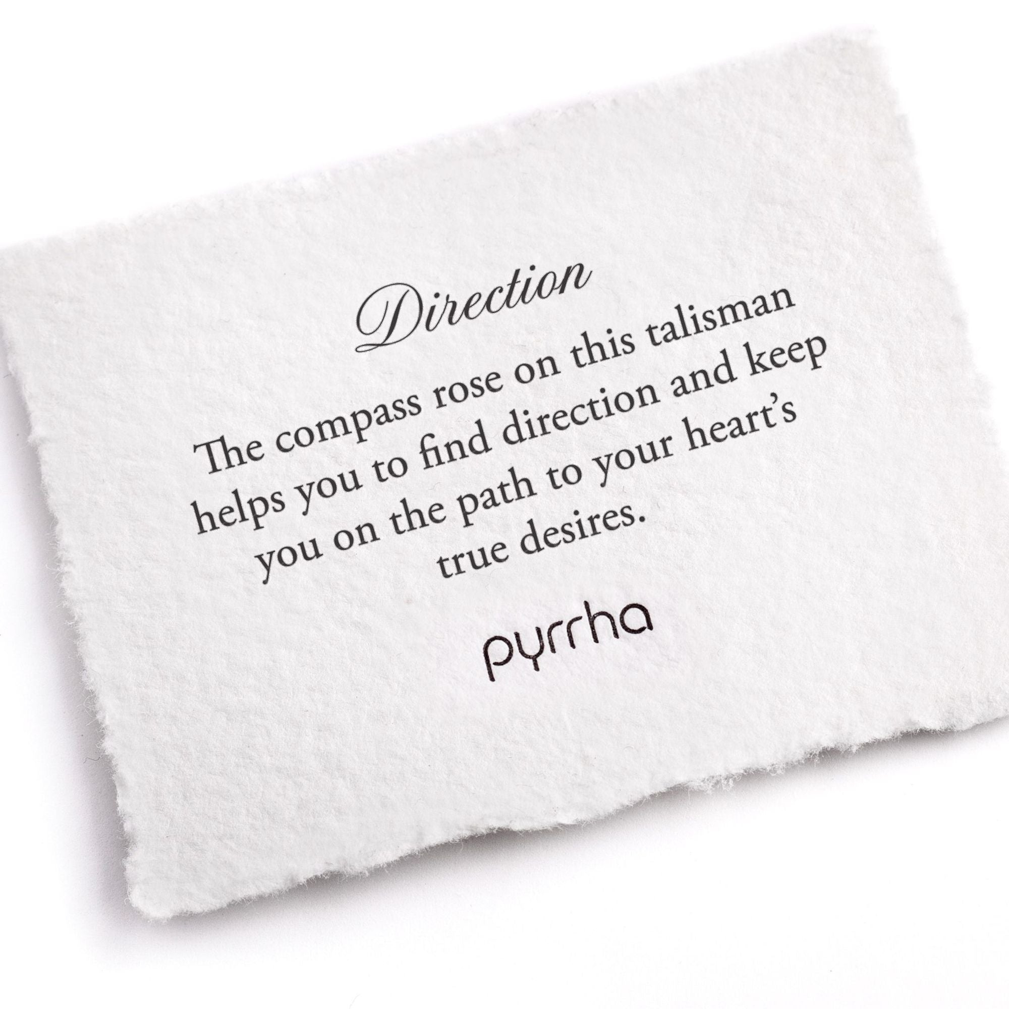 A handtorn cotton card describing the meaning for our Direction Bar Bracelet.