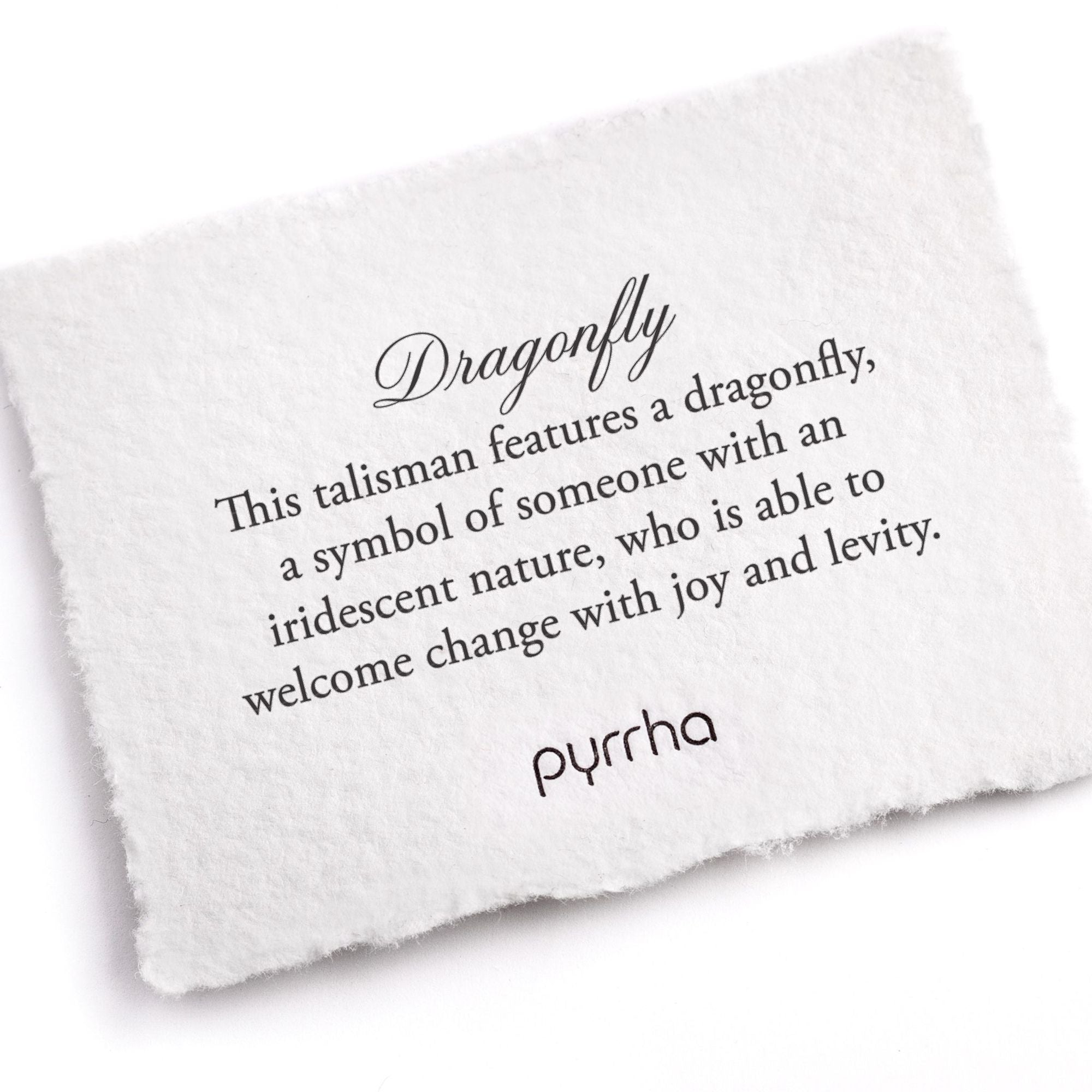 A handtorn cotton card describing the meaning for our Dragonfly 14K Gold On Silver.