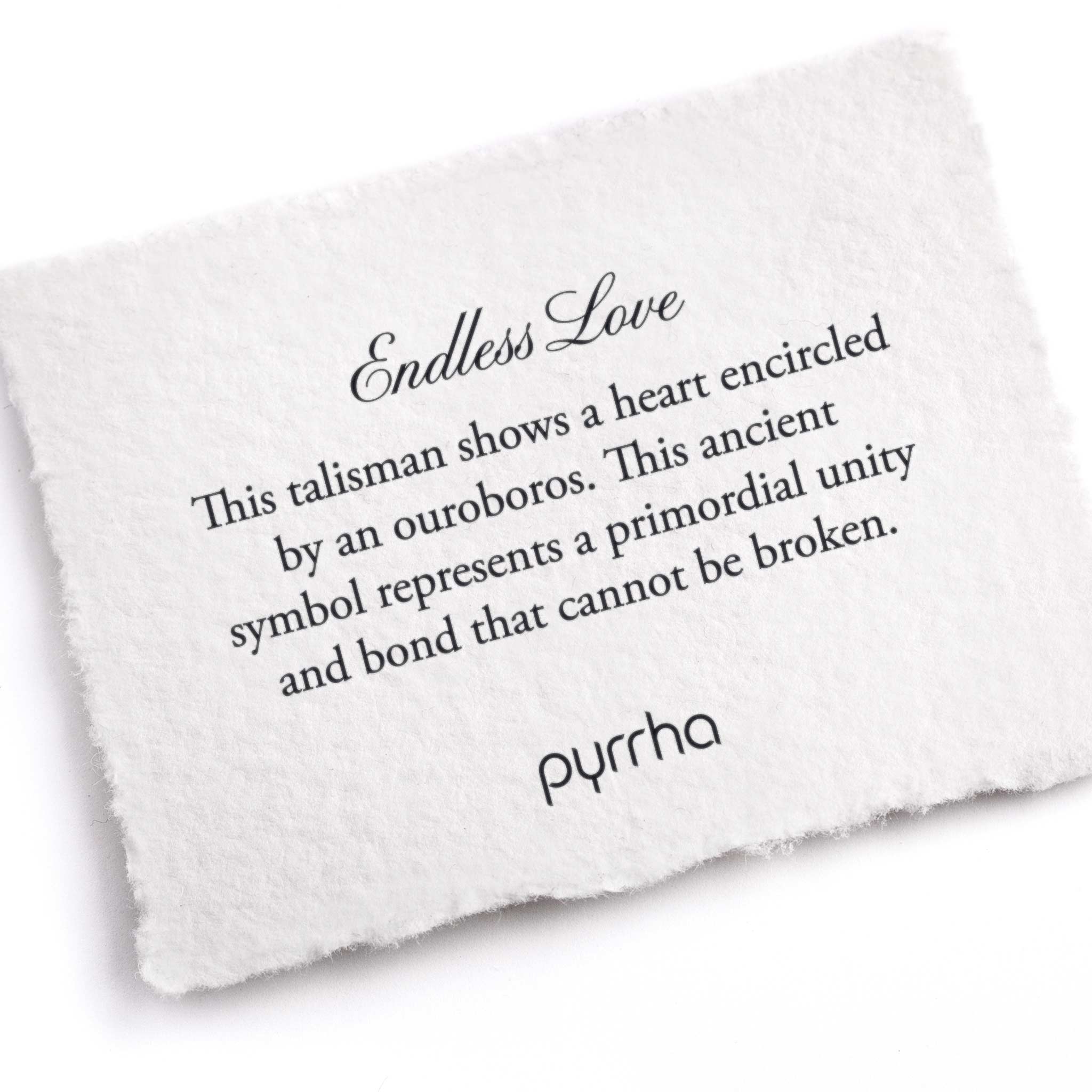 A hand-torn, letterpress printed card describing the meaning for Pyrrha's Endless Love Talisman