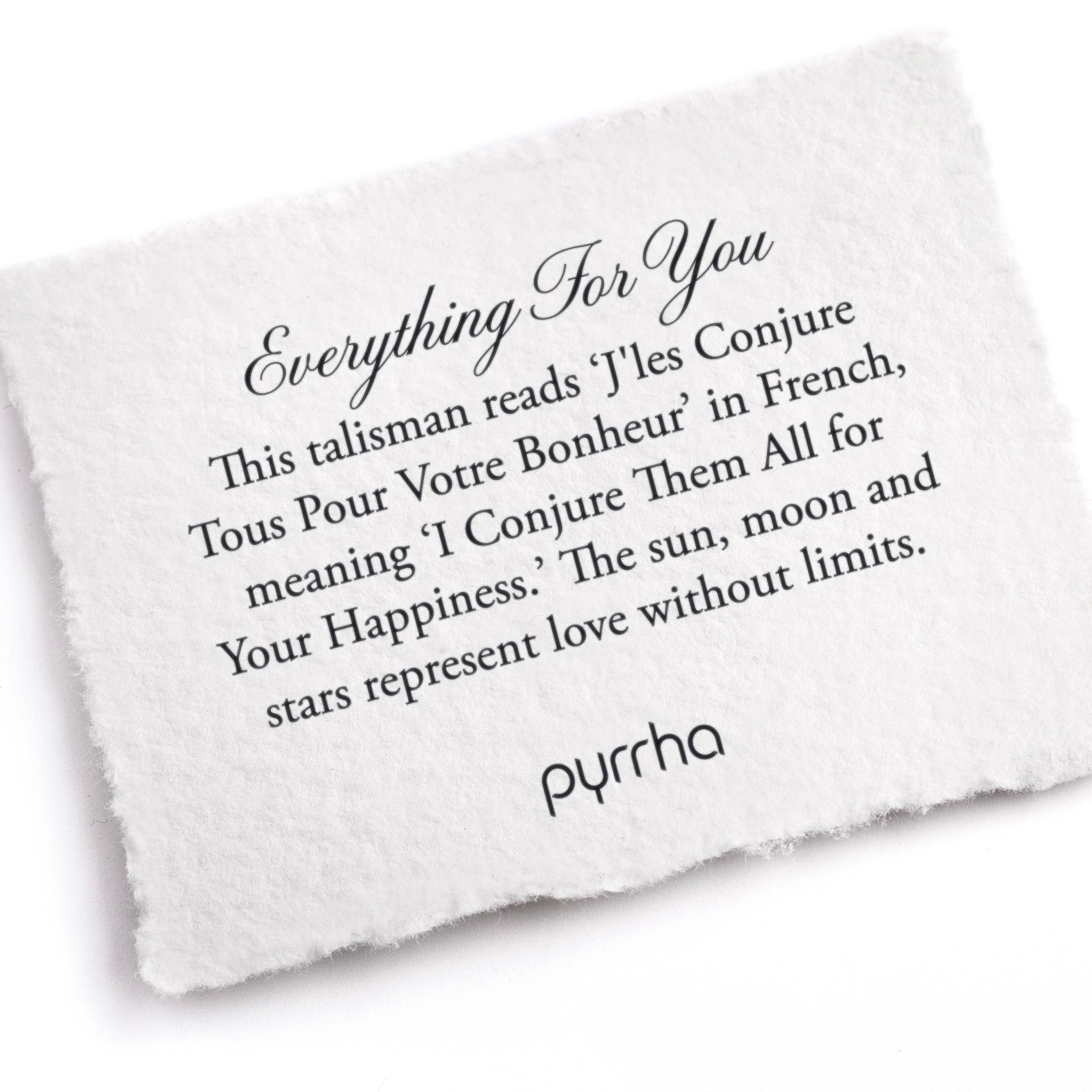 A hand-torn, letterpress printed card describing the meaning for Pyrrha's Everything For You 14K Gold Talisman