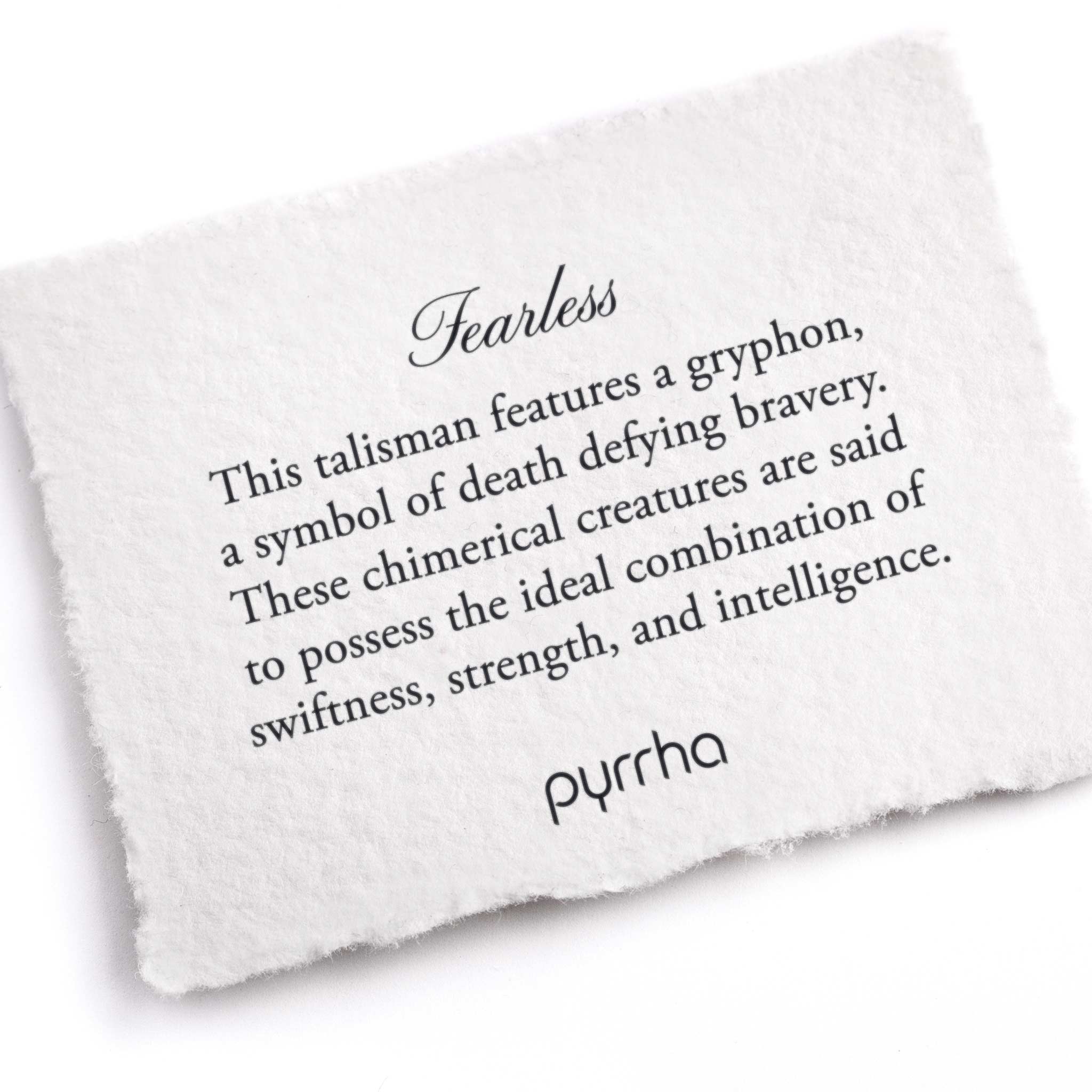 A hand-torn, letterpress printed card describing the meaning for Pyrrha's Fearless Talisman 