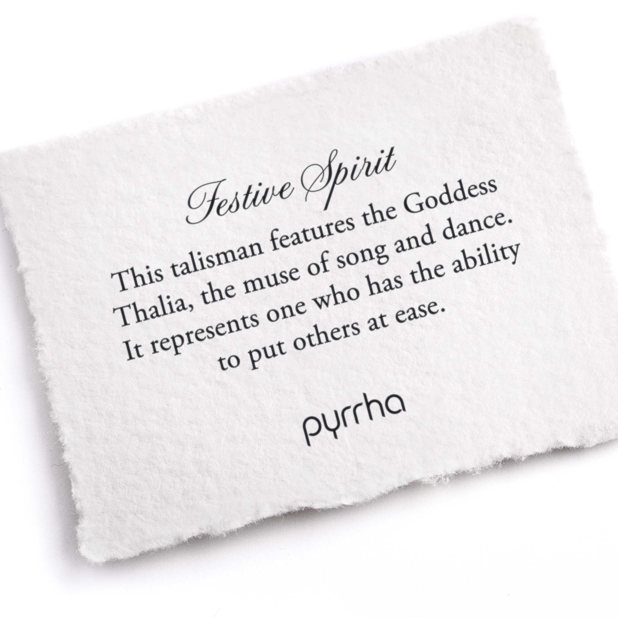 A hand-torn, letterpress printed card describing the meaning for Pyrrha's Festive Spirit Talisman