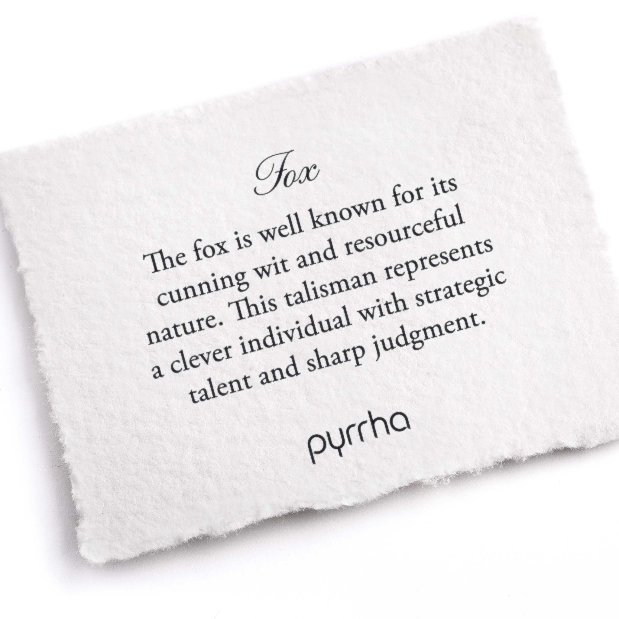 A hand-torn, letterpress printed card describing the meaning for Pyrrha's Fox Talisman 