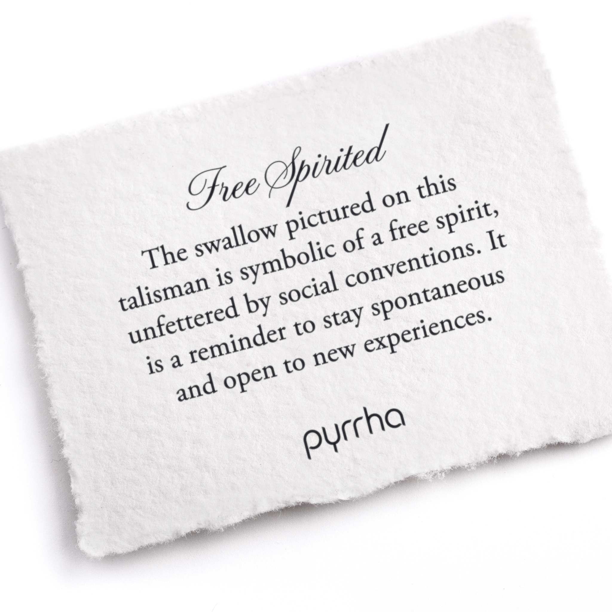 A hand-torn, letterpress printed card describing the meaning for Pyrrha's Free Spirited Knotted Pearl Necklace - Black