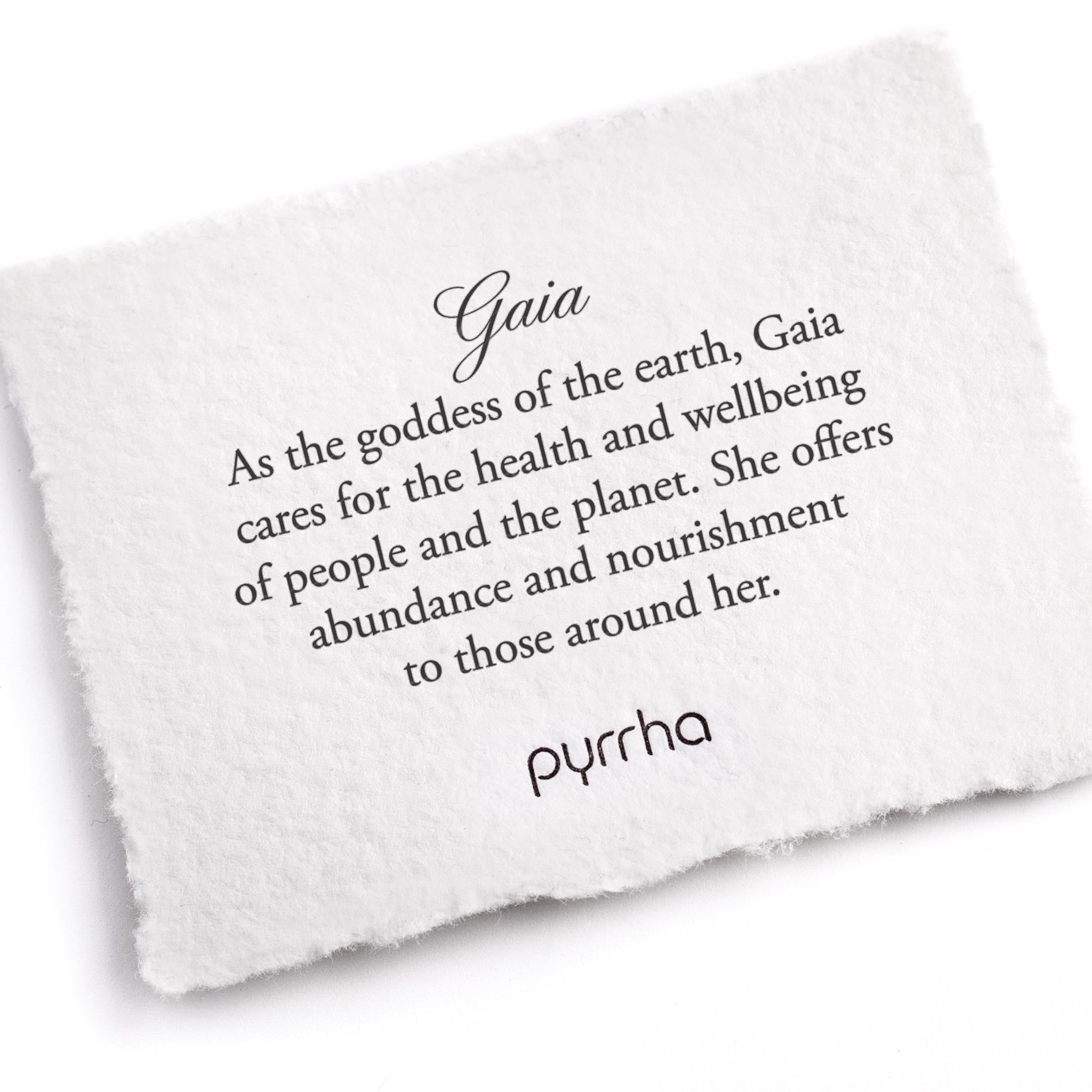 A hand-torn, letterpress printed card describing the meaning for Pyrrha's Gaia Goddess Talisman