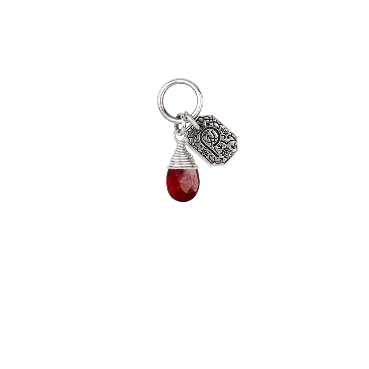 A signature sterling silver attraction charm capped with a garnet stone.
