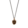 A bronze Gemini zodiac charm on a silver chain.