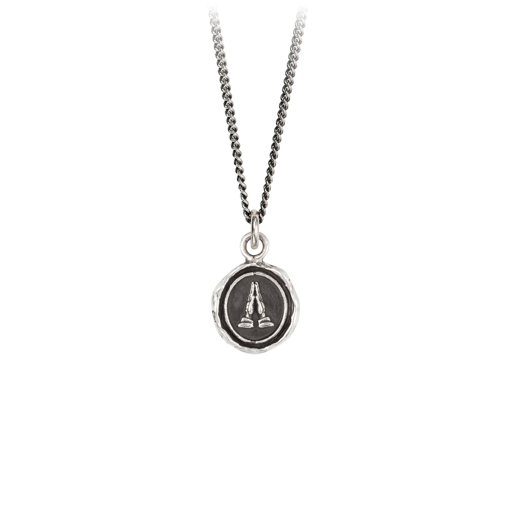 A Oxidized Silver Grateful talisman on a silver chain.