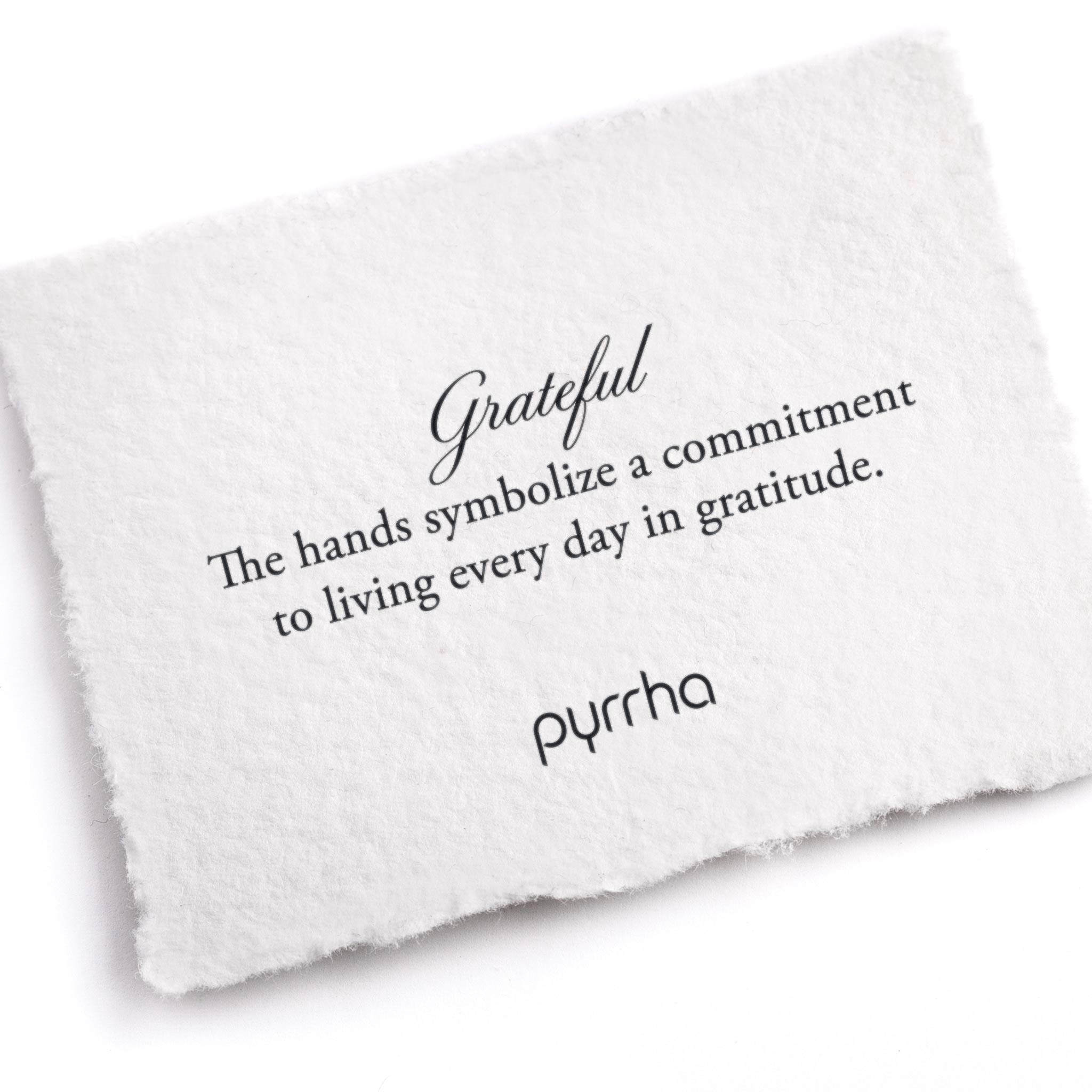 A hand-torn, letterpress printed card describing the meaning for Pyrrha's Grateful Appreciation Talisman