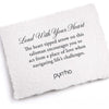A hand-torn, letterpress printed card describing the meaning for Pyrrha's Lead With Your Heart 14K Gold Talisman