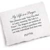 A hand-torn, letterpress printed card describing the meaning for Pyrrha's My Life Is A Prayer 14K Gold Talisman