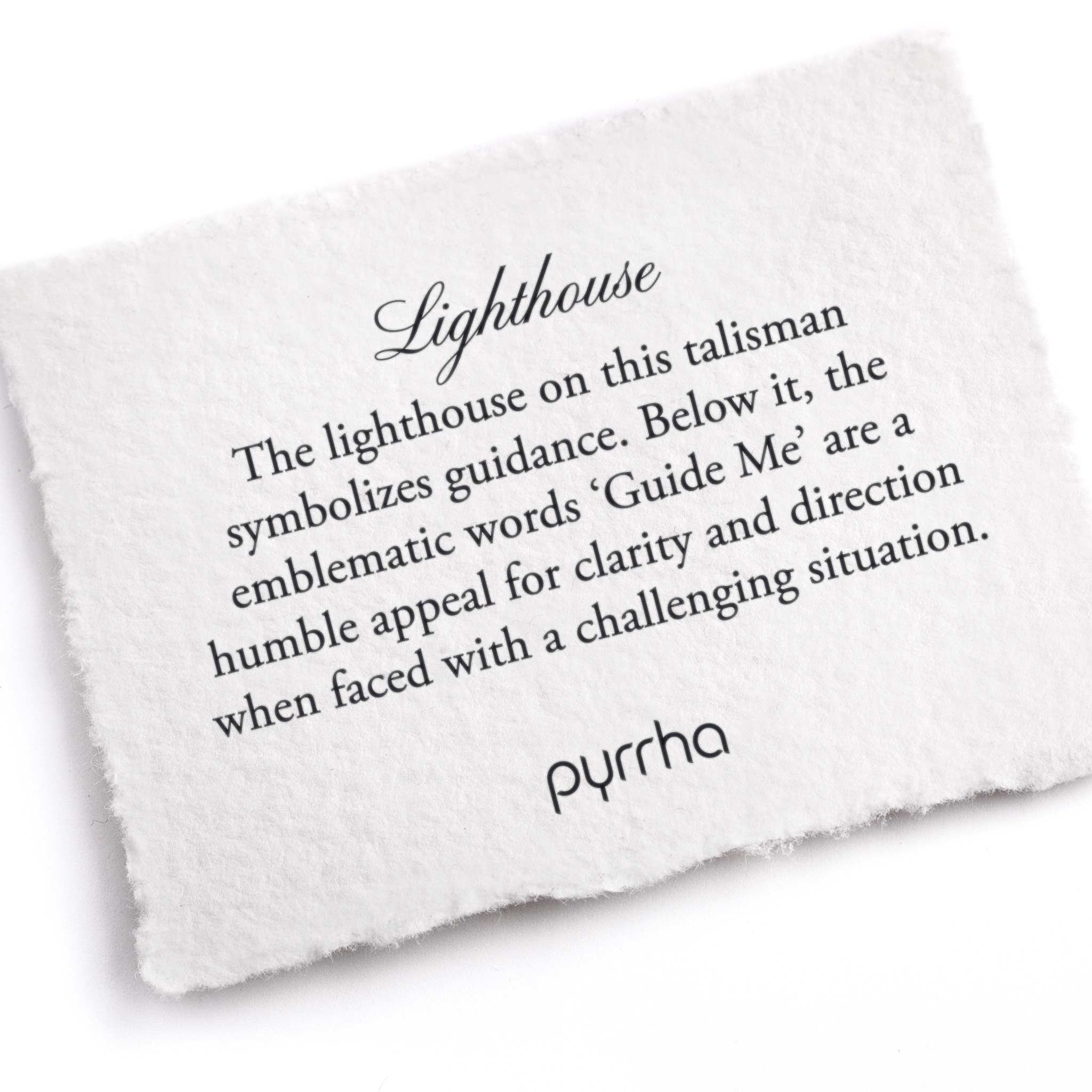 A hand-torn, letterpress printed card describing the meaning for Pyrrha's Lighthouse Talisman