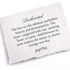 A hand-torn, letterpress printed card describing the meaning for Pyrrha's Lionhearted Signature Talisman Necklace