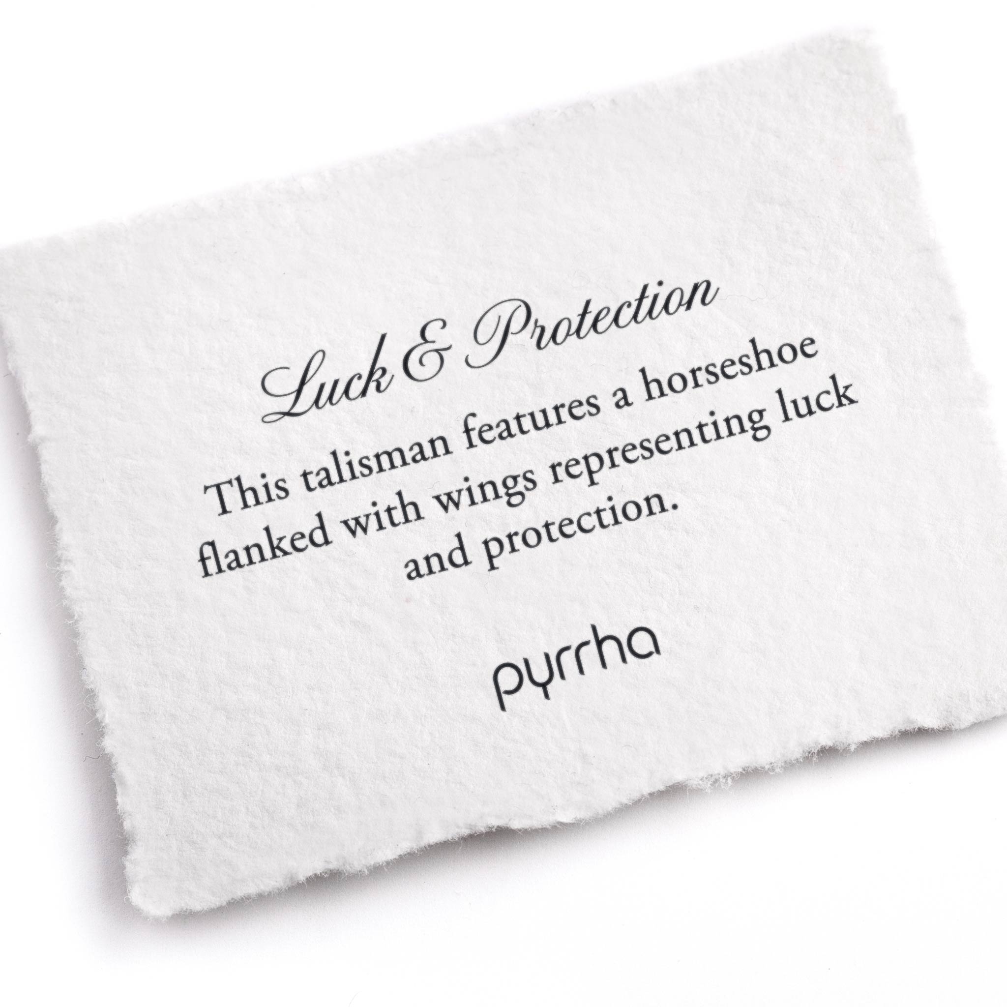 A hand-torn, letterpress printed card describing the meaning for Pyrrha's Luck & Protection Wide Braided Bracelet