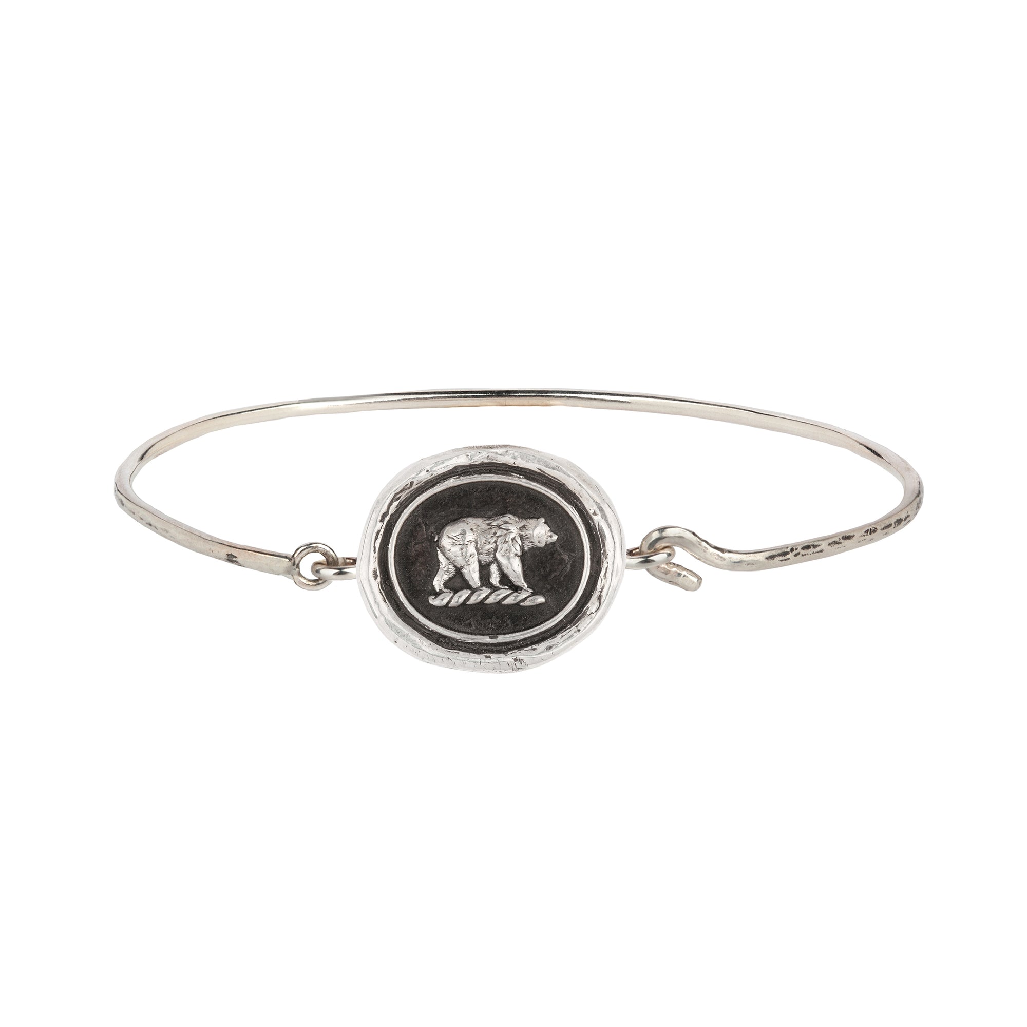 A hard sterling silver band fastened with a hook and eye clasp featuring our Mother Bear talisman.