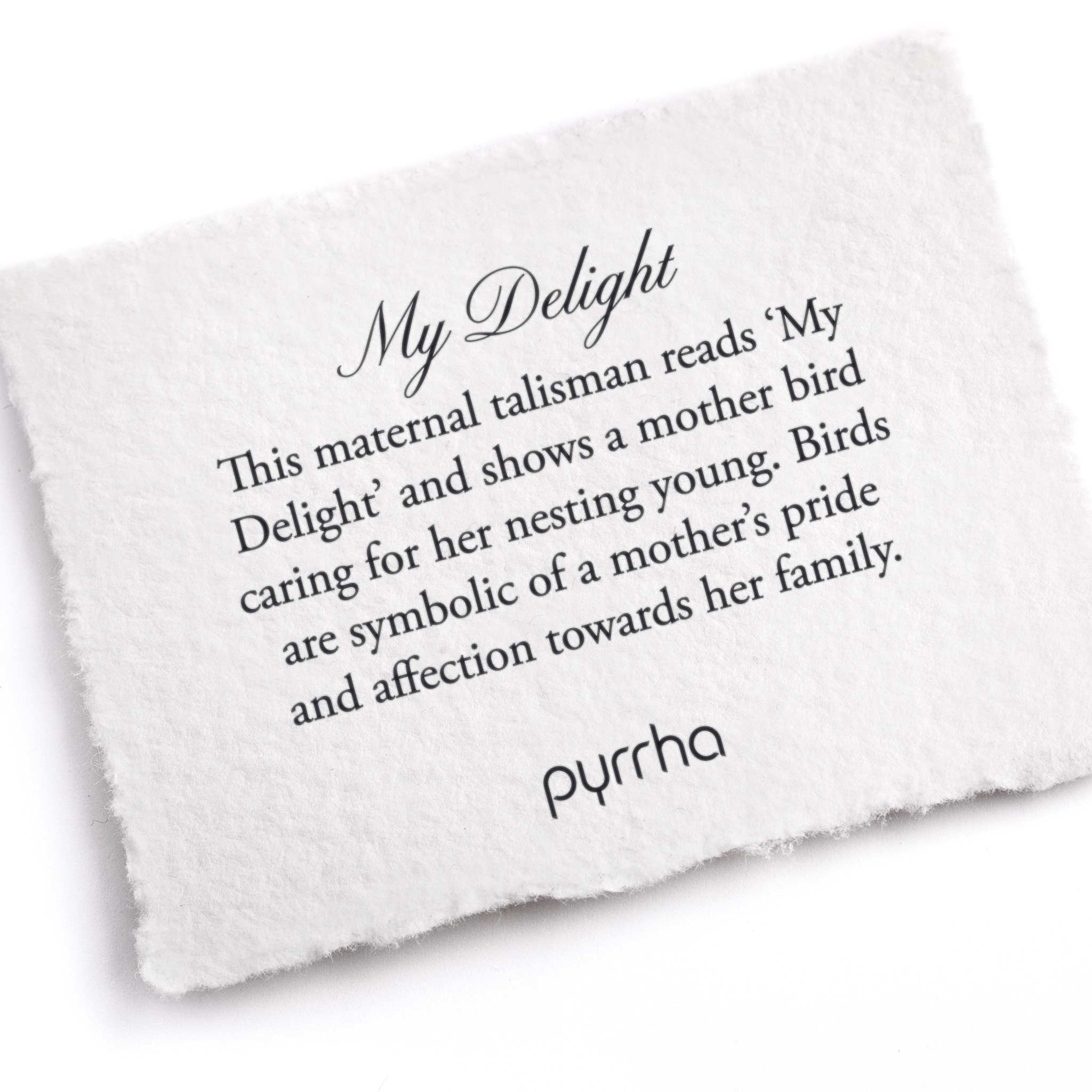 A hand-torn, letterpress printed card describing the meaning for Pyrrha's My Delight Talisman