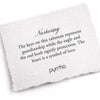 A hand-torn, letterpress printed card describing the meaning for Pyrrha's Nurturing Talisman