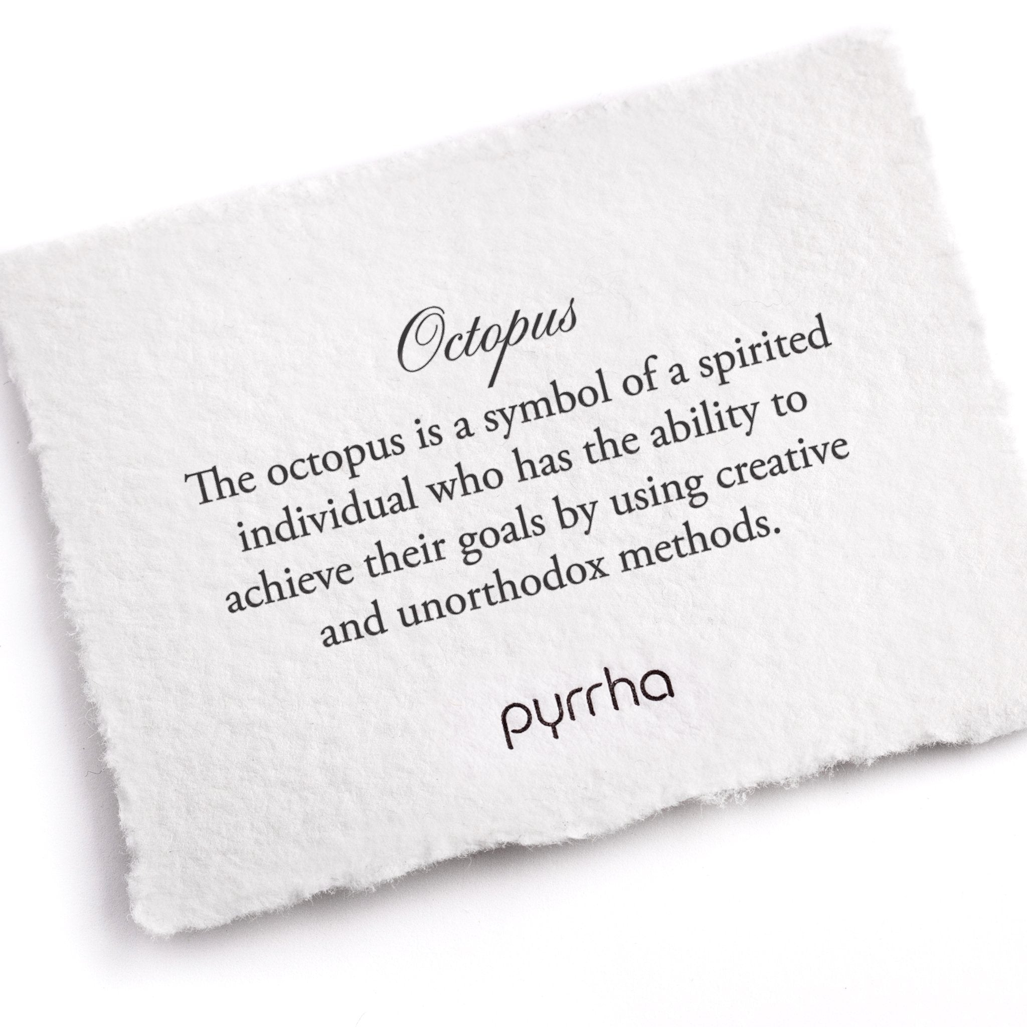 A hand-torn, letterpress printed card describing the meaning for Pyrrha's Octopus Talisman