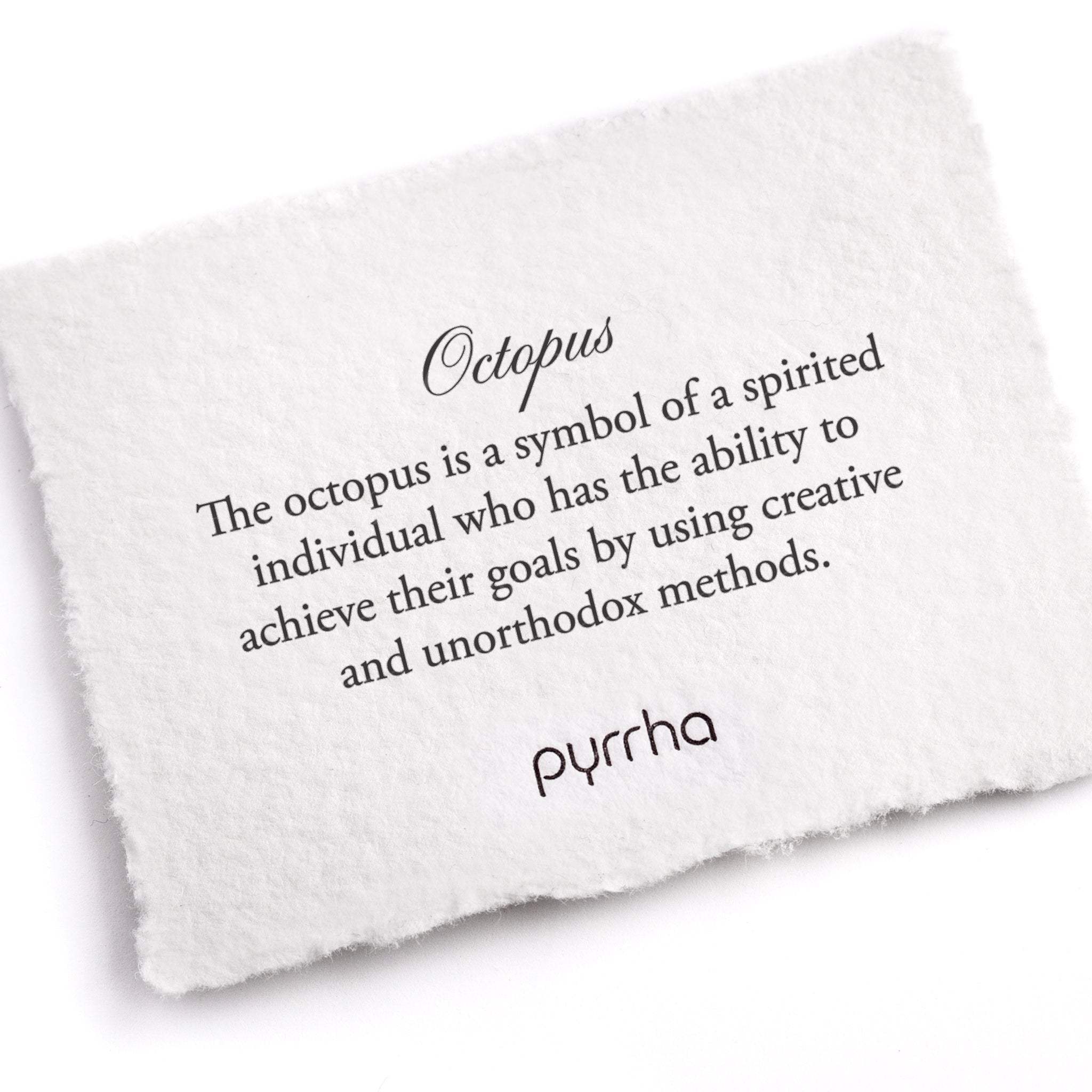 A hand-torn, letterpress printed card describing the meaning for Pyrrha's Octopus Talisman Necklace