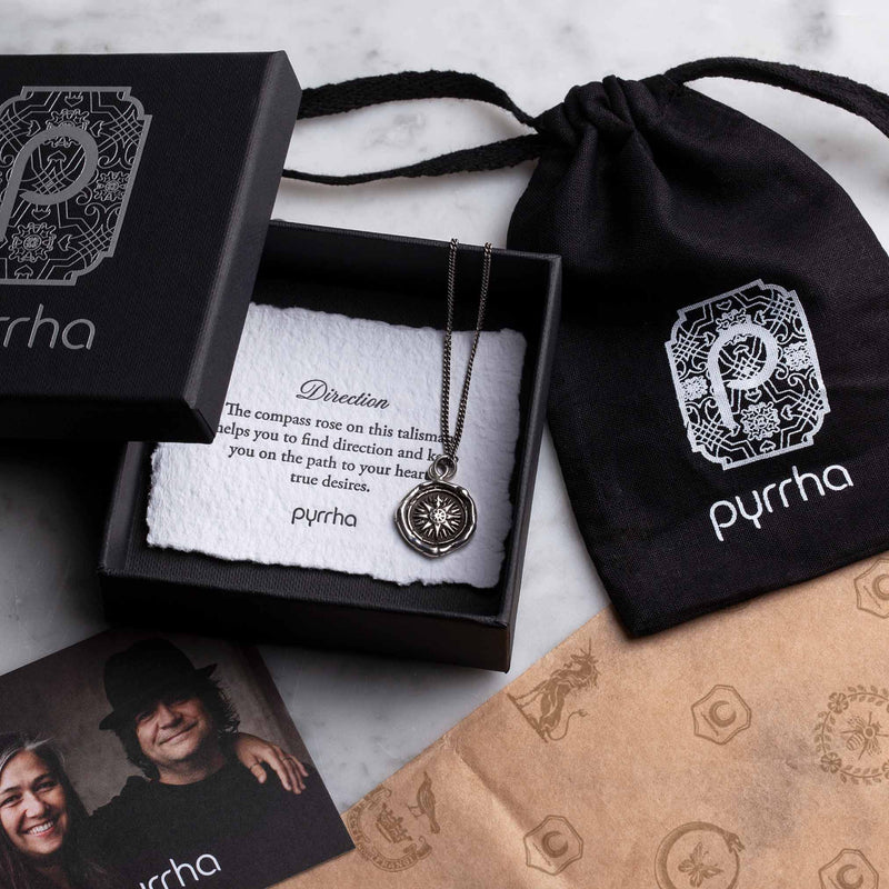 A black gift box with our Pyrrha logo on the top
