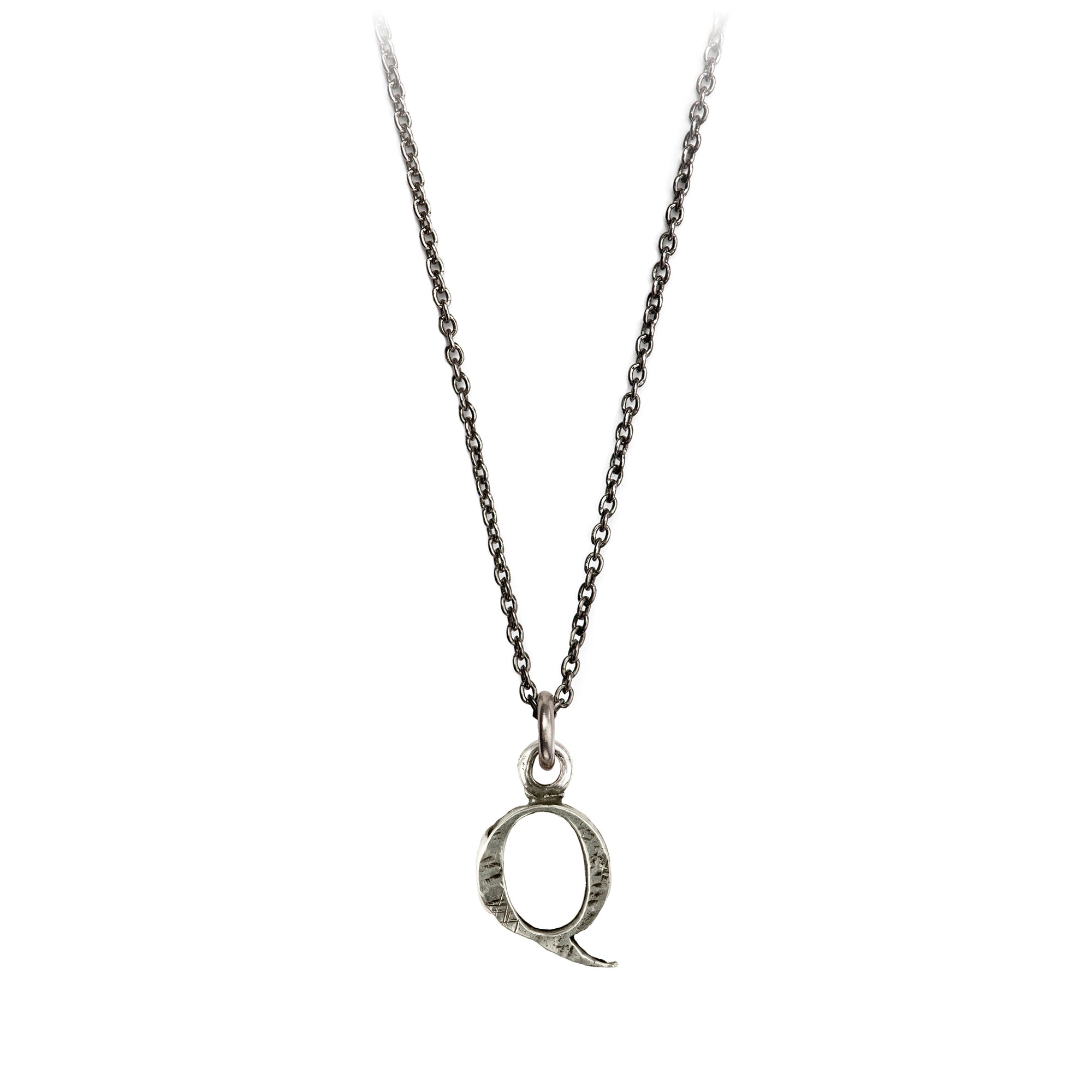 A sterling silver letter "Q" charm on a silver chain.