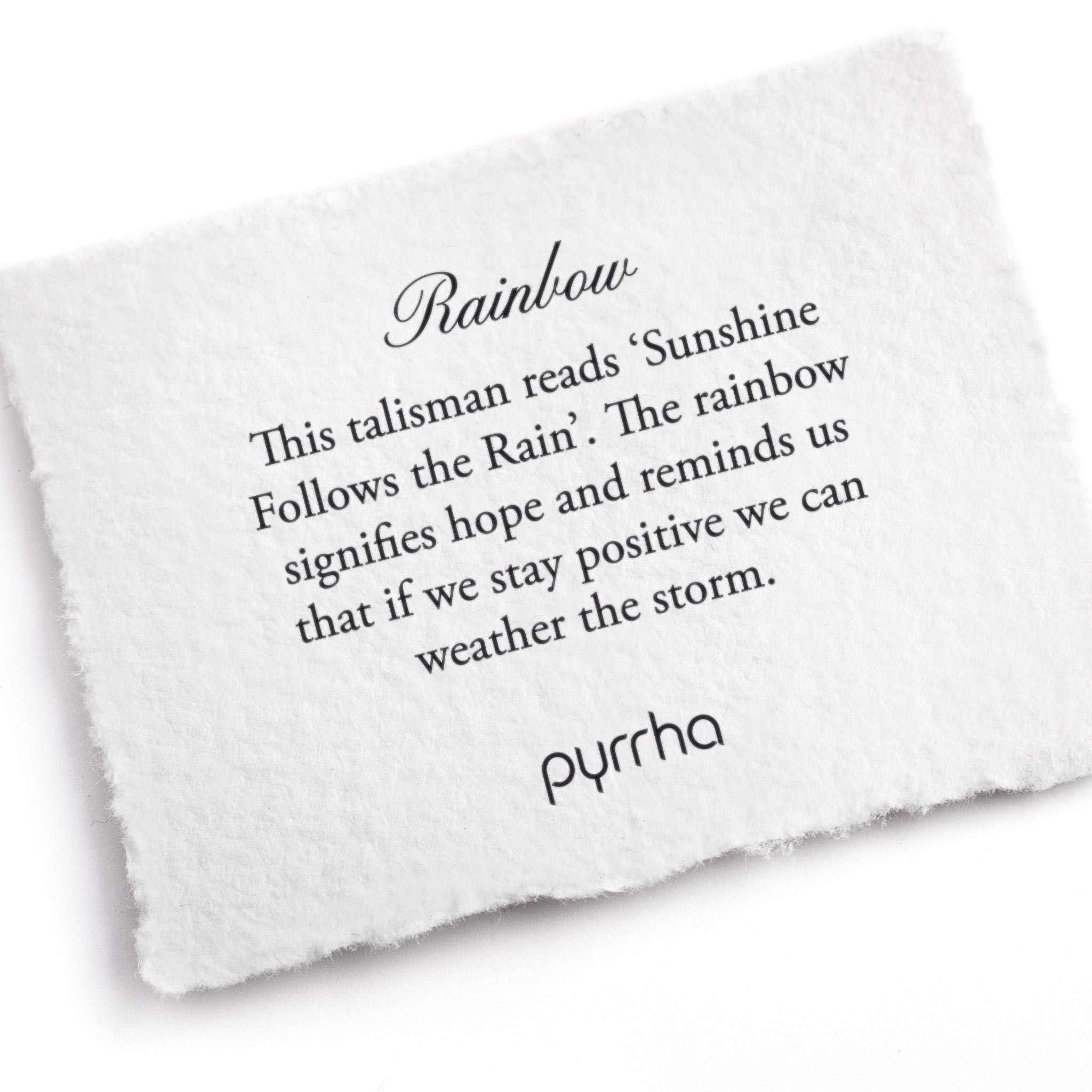 A hand-torn, letterpress printed card describing the meaning for Pyrrha's Rainbow Talisman