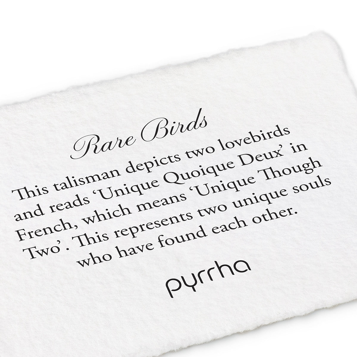 A hand-torn, letterpress printed card describing the meaning for Pyrrha's Rare Birds Talisman Necklace