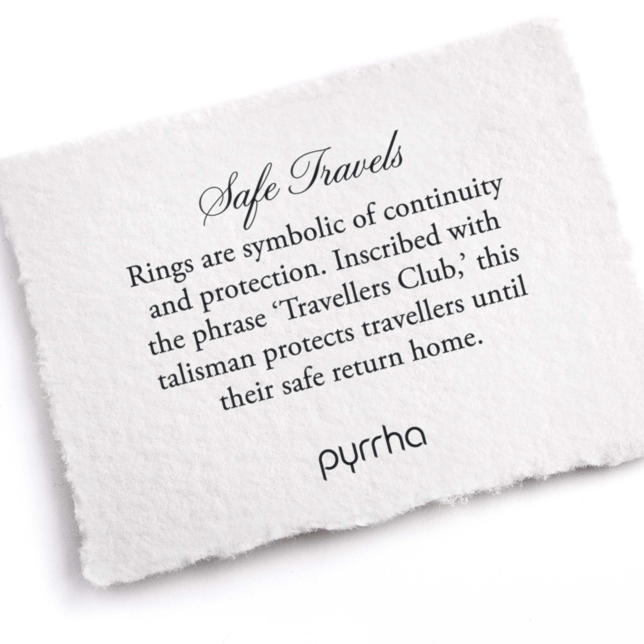 A hand-torn, letterpress printed card describing the meaning for Pyrrha's Safe Travels Talisman