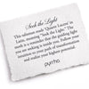 A hand-torn, letterpress printed card describing the meaning for Pyrrha's Seek The Light 14K Gold Talisman