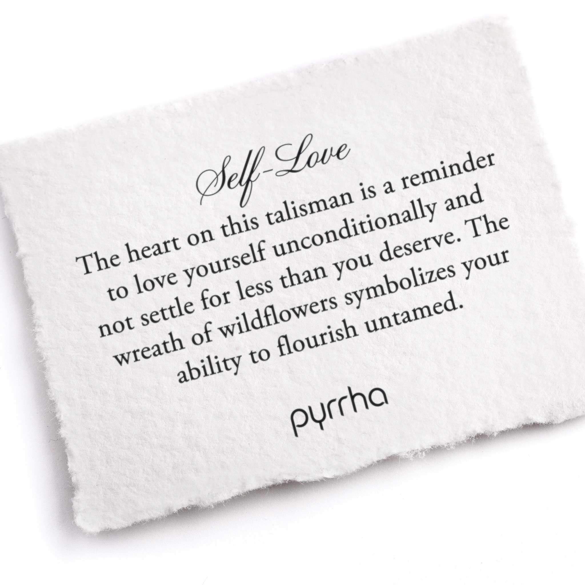 A hand-torn, letterpress printed card describing the meaning for Pyrrha's Self-Love Talisman