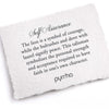 A handtorn cotton card describing the meaning for Pyrrha's Self Assurance Talisman