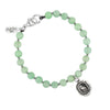 A green beaded bracelet featuring our sterling silver Tireless talisman.
