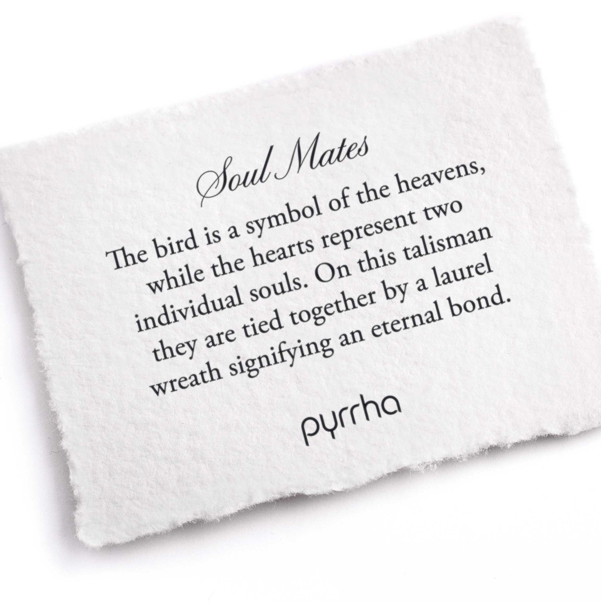 A hand-torn, letterpress printed card describing the meaning for Pyrrha's Soul Mates 14K Gold Talisman