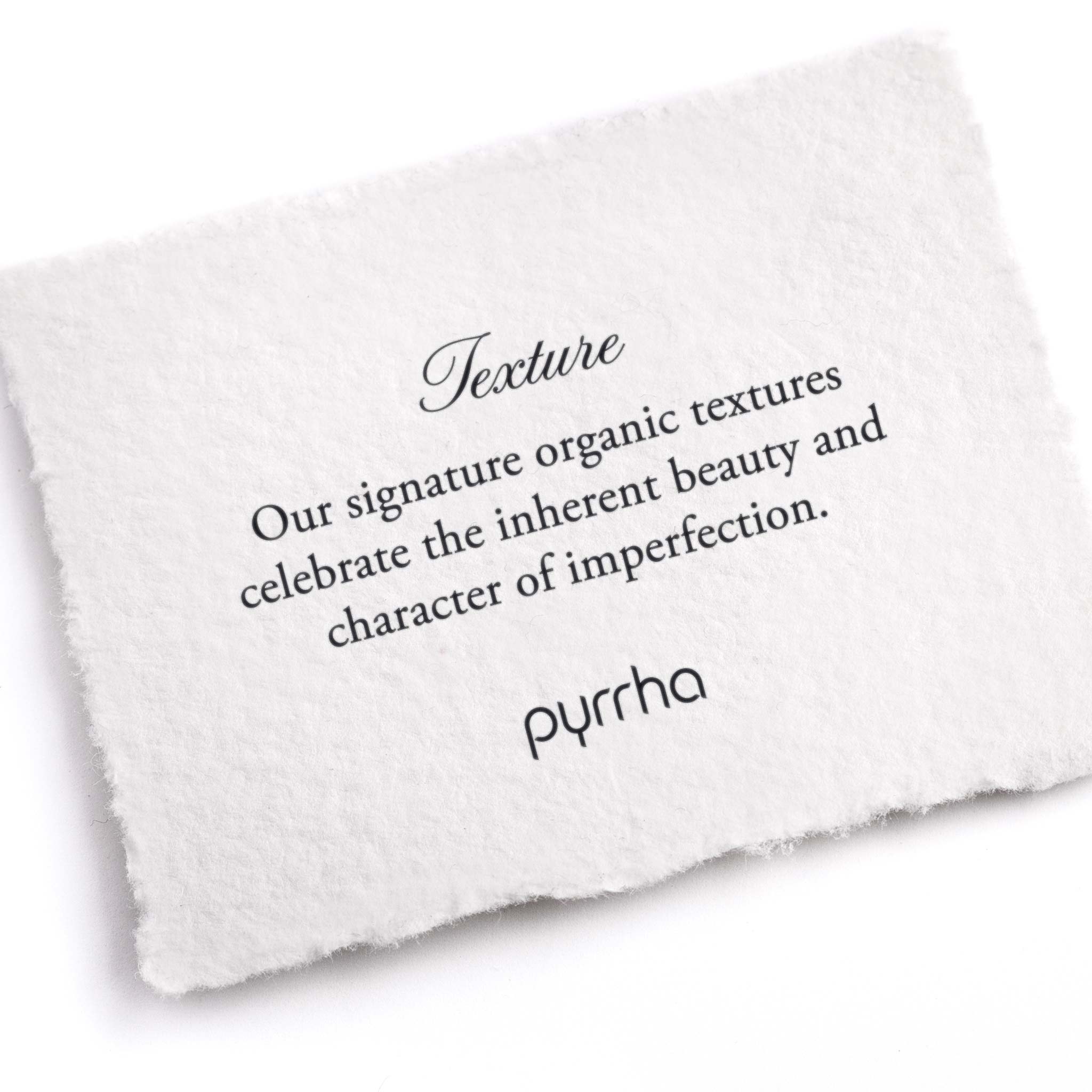 A hand-torn, letterpress printed card describing the meaning for Pyrrha's organic textures